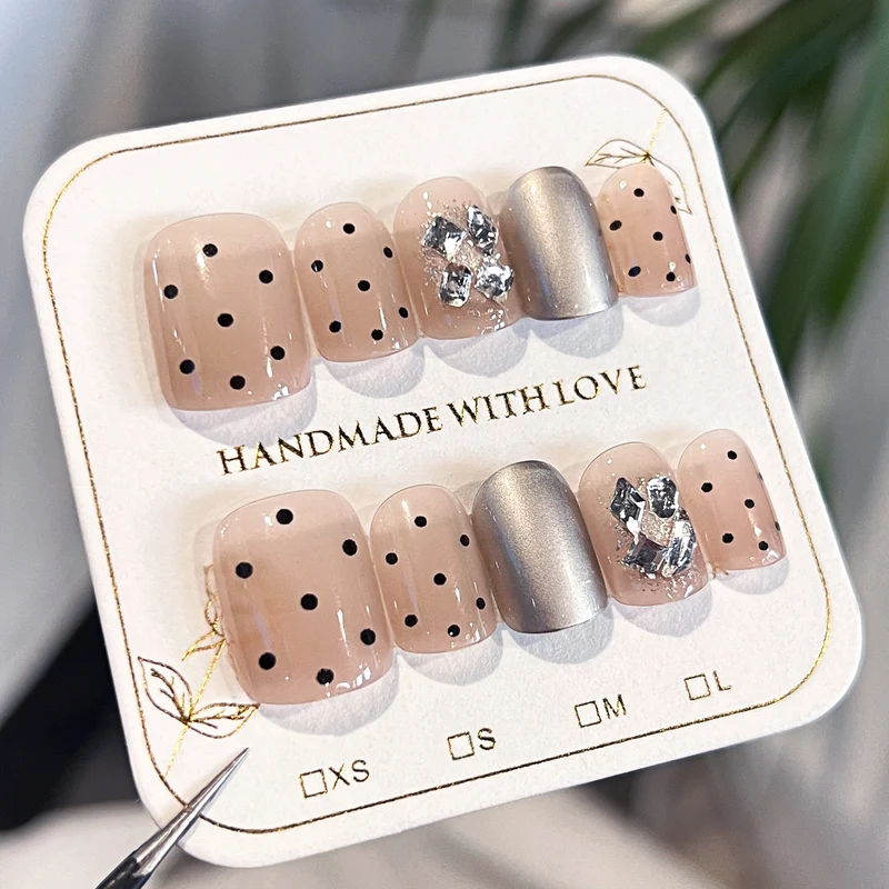 Artificial nail extensions with elegant accent decoration Stornfield