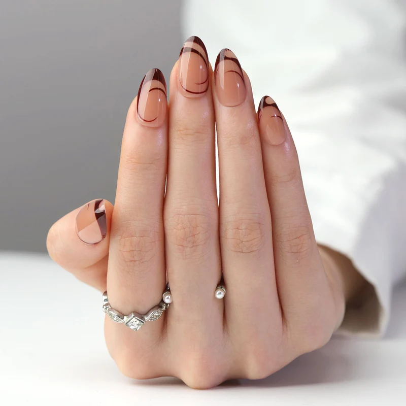 Artificial nail art with playful dots and bows Stornfield