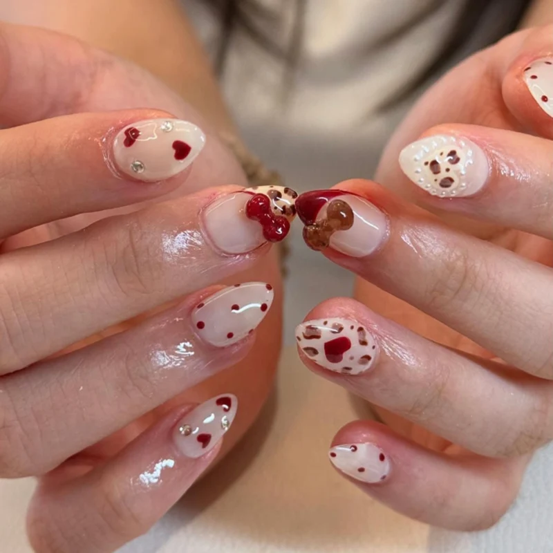 Artificial nail art with playful dots and bows Stornfield