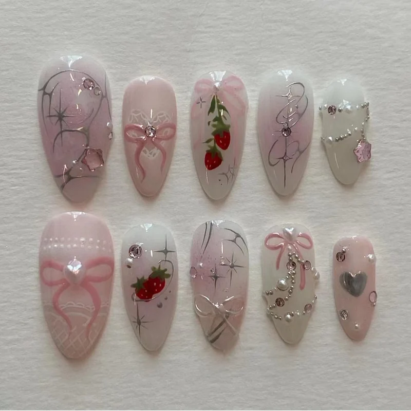 Artificial nail art with romantic design and glitter accents Stornfield
