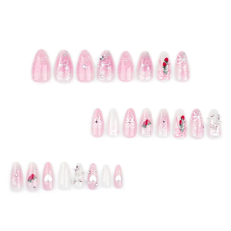 Artificial nail art with romantic design and glitter accents Stornfield