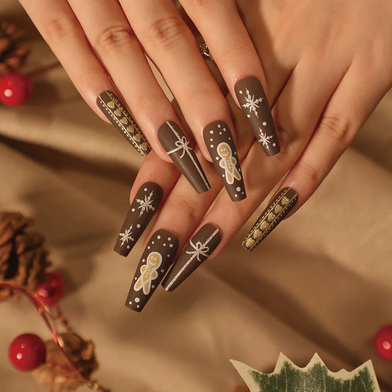 Artificial nail art with festive gingerbread design Stornfield
