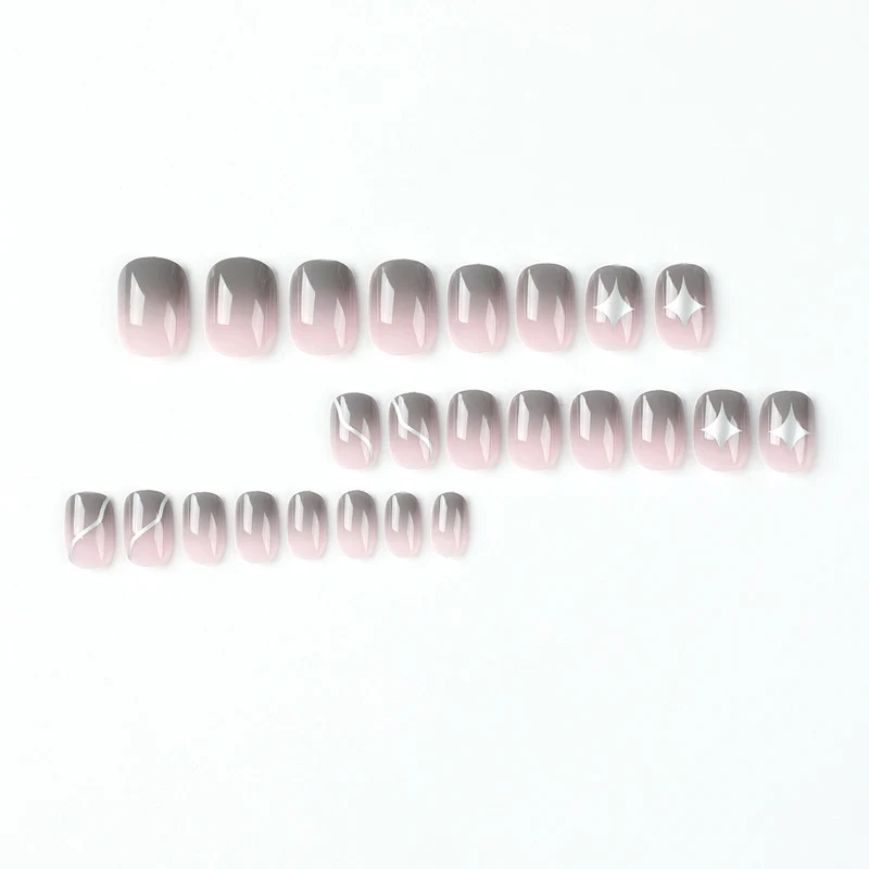 Artificial nail art with elegant ombre design and charming accents Stornfield