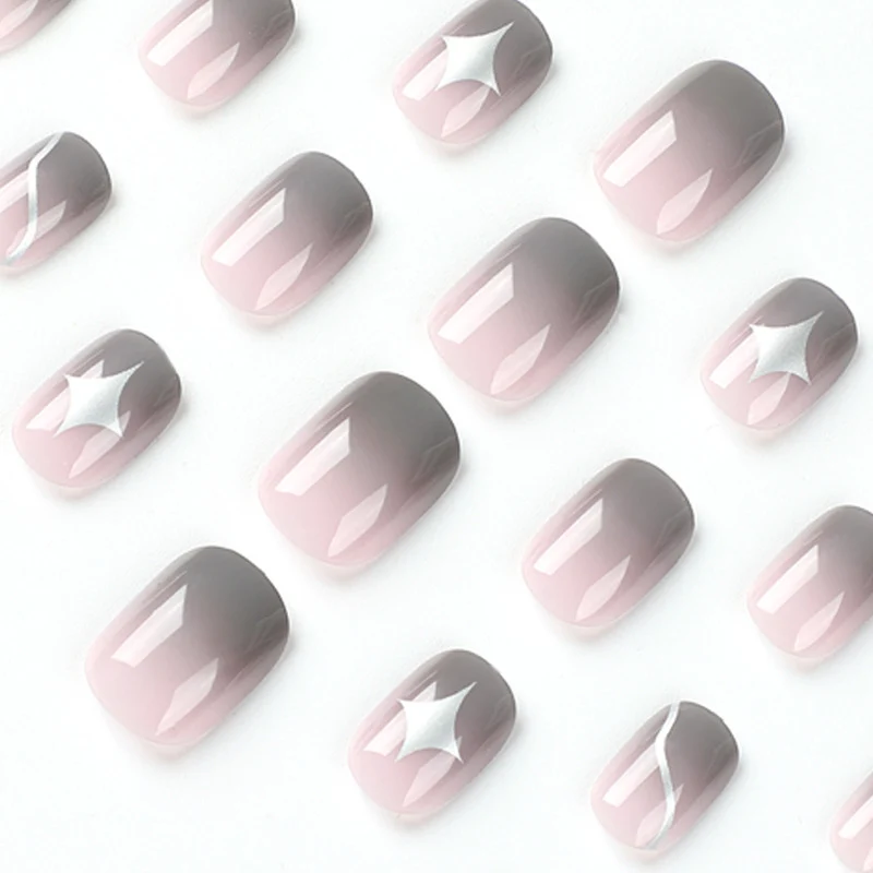 Artificial nail art with elegant ombre design and charming accents Stornfield