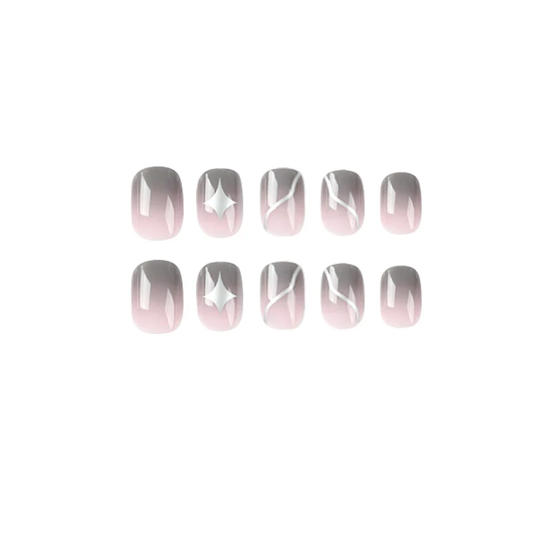 Artificial nail art with elegant ombre design and charming accents Stornfield