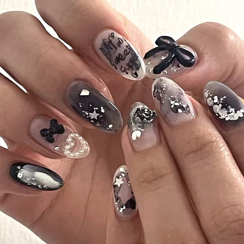 Artificial nail art with unique black and white design Stornfield
