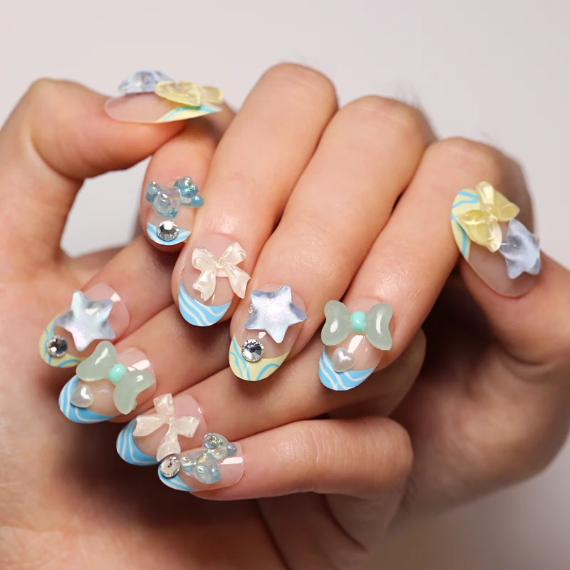 Artificial nail art with colorful pastel designs and 3D embellishments Stornfield