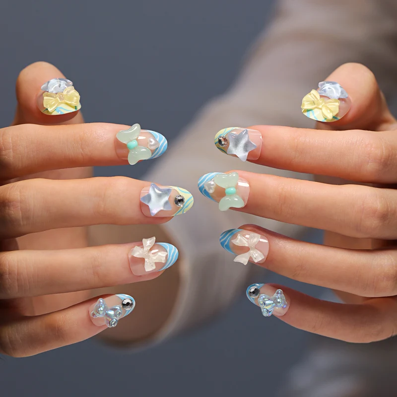 Artificial nail art with colorful pastel designs and 3D embellishments Stornfield