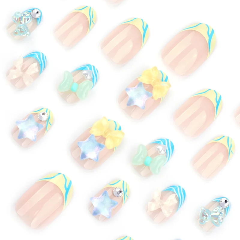 Artificial nail art with colorful pastel designs and 3D embellishments Stornfield