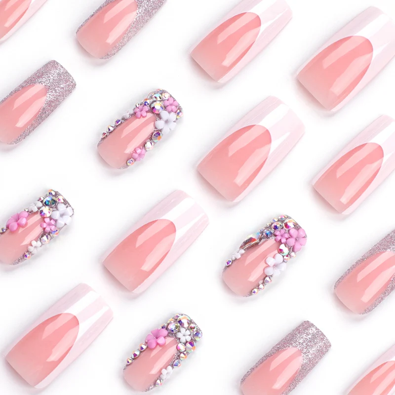 Artificial nails with floral decorations and glitter effects Stornfield