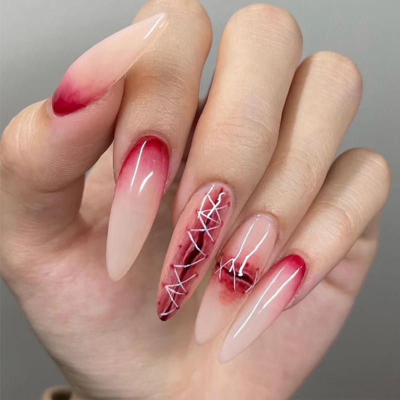 Creative Stiletto Nail Art with Blood Red Accents Stornfield