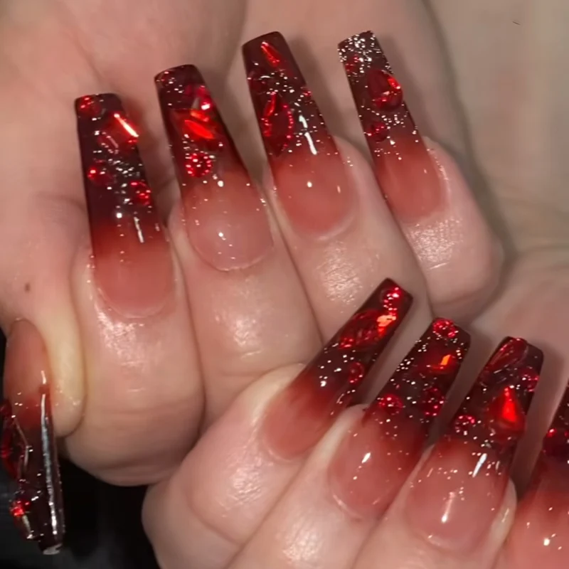 Creative Stiletto Nail Art with Blood Red Accents Stornfield