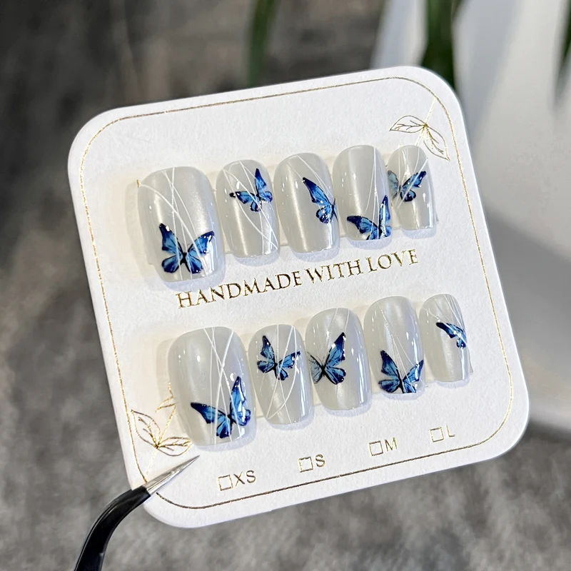 Creative nail extensions with intricate butterfly design Stornfield