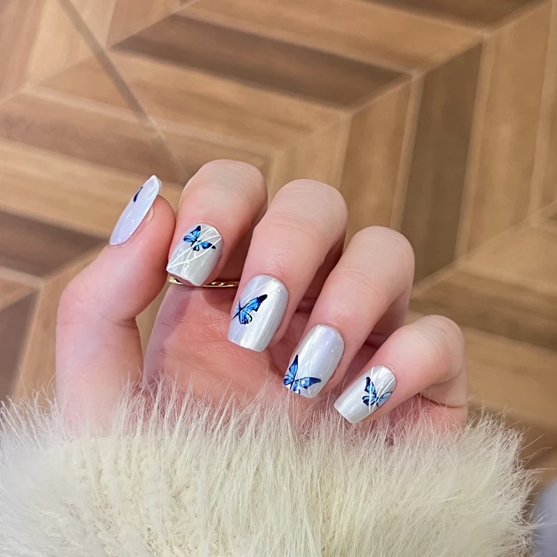 Creative nail extensions with intricate butterfly design Stornfield