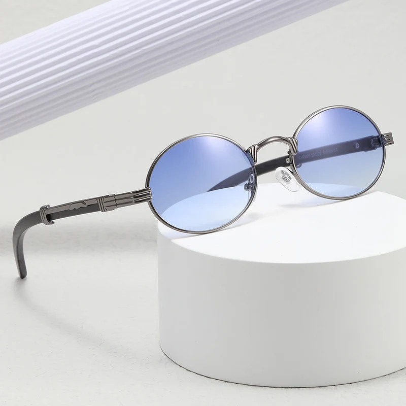 Dame rund designer solbrille med innovativ metallramme Luvikno