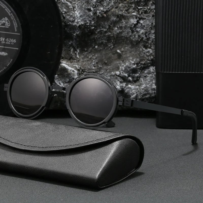 Damer moteriktig rund solbrille med elegant metallramme Luvikno