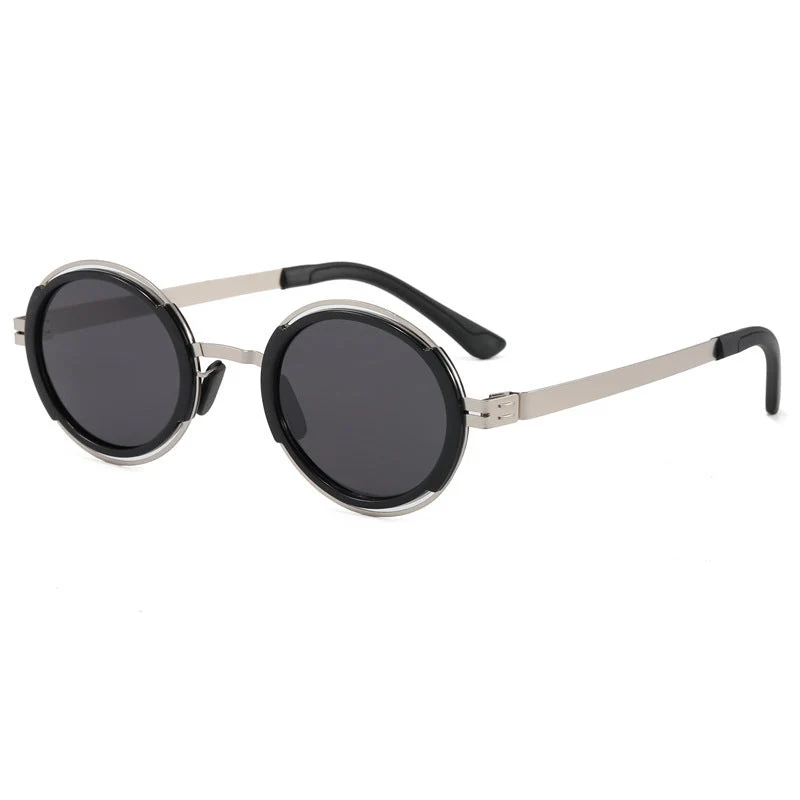 Damer moteriktig rund solbrille med elegant metallramme Luvikno