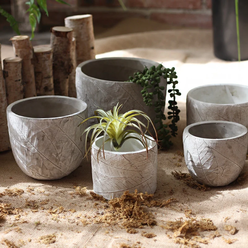 Decorative plant container made of handmade ceramic with leaf pattern Stornfield