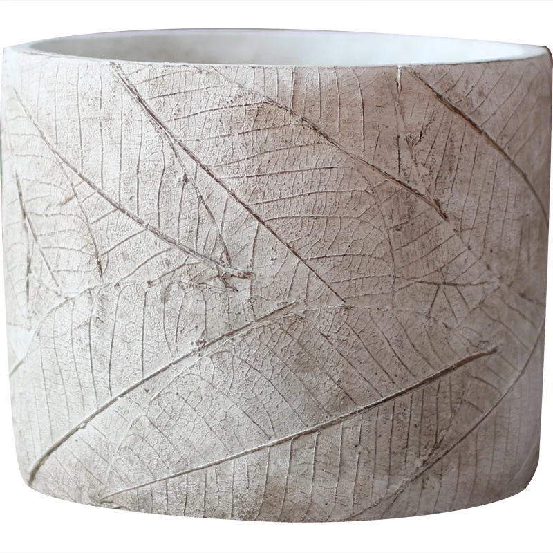Decorative plant container made of handmade ceramic with leaf pattern Stornfield