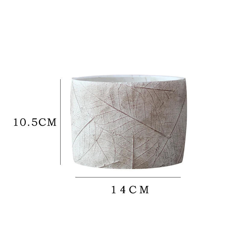 Decorative plant container made of handmade ceramic with leaf pattern Stornfield