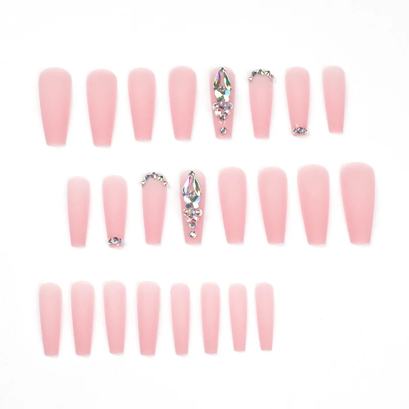Artistic acrylic nails with glitter and rhinestone embellishments Stornfield