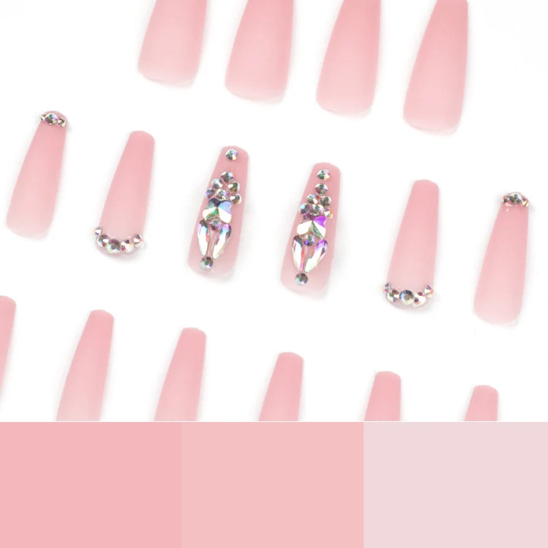 Artistic acrylic nails with glitter and rhinestone embellishments Stornfield