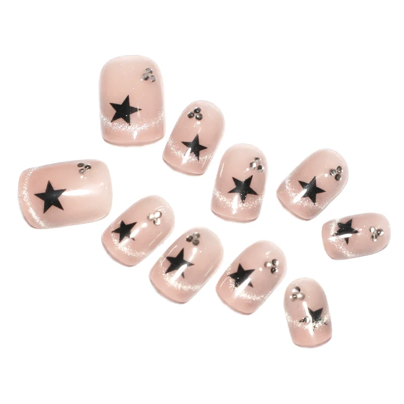 Artistic acrylic nails with glamorous star motifs Stornfield