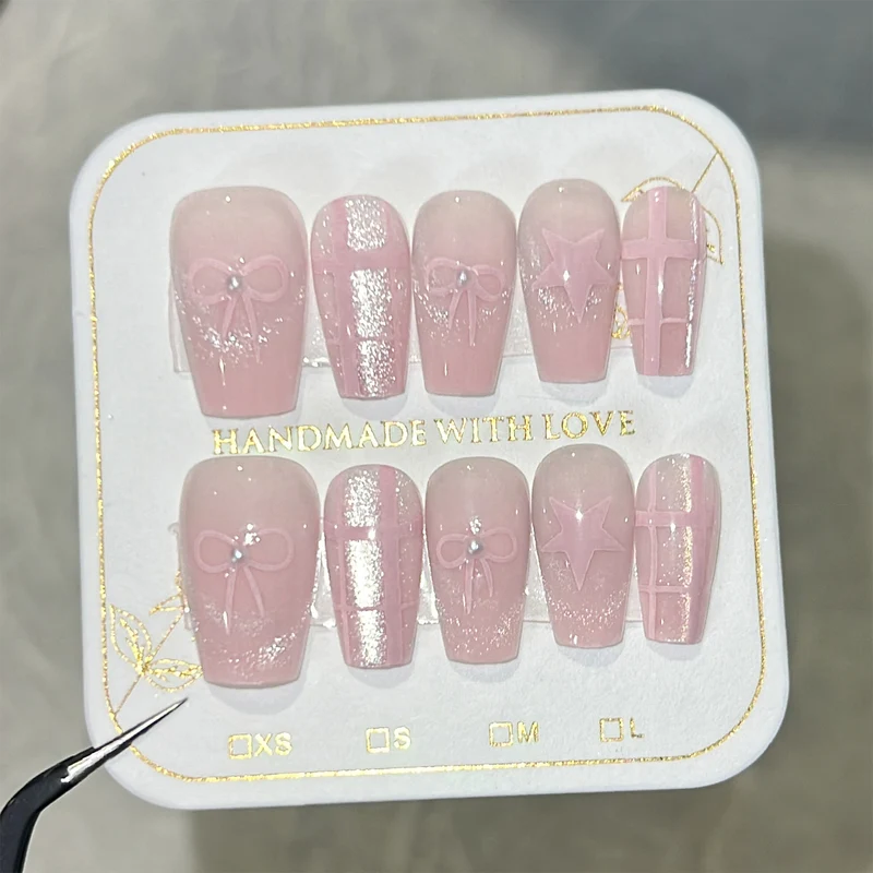 Artistic acrylic nails with elegant bow and star designs Stornfield