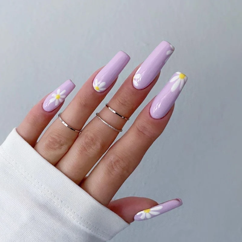 Artistic acrylic nails with flower decoration Stornfield