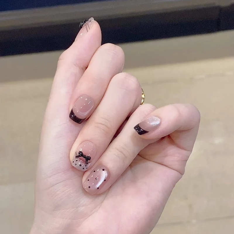 Elegant French Tip Nail Art Set with Decorative Accents Stornfield