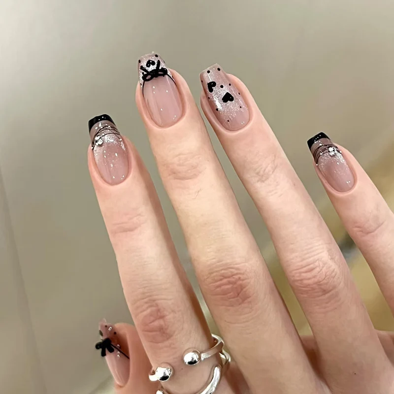 Elegant Artful Nail Design with Bow and Sparkle Accents Stornfield