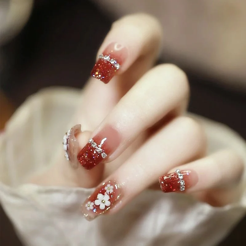 Artistic Press-On Nail Art with Floral and Glitter Accents Stornfield