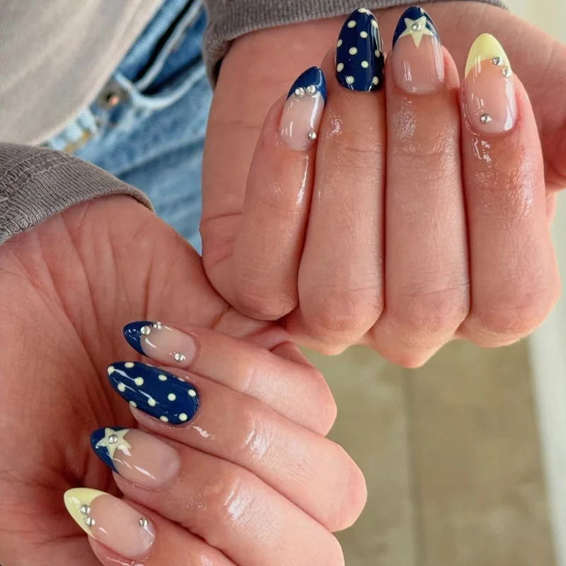 Artistic Nail Design with Star and Polka Dot Accents Stornfield