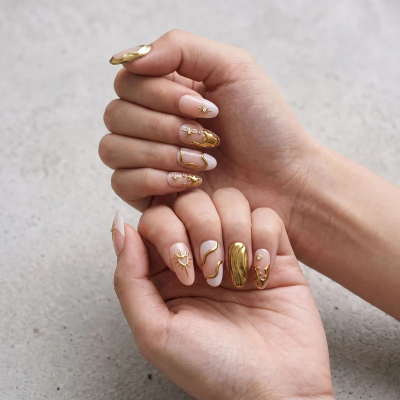 Artistic Gold Embellished Nail Art Stornfield