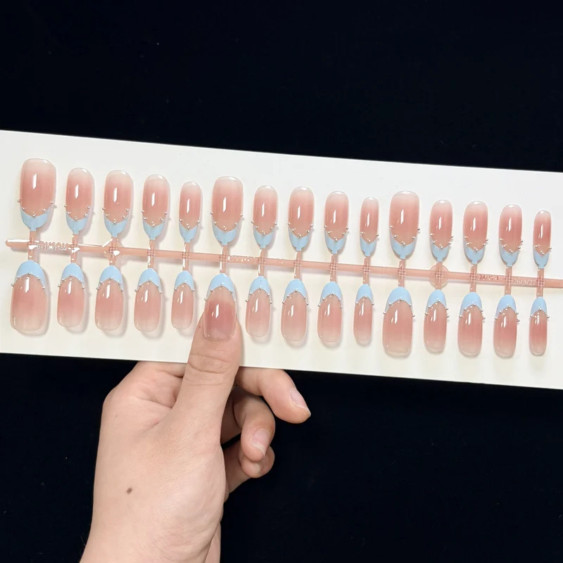 Artistic French Tip Nail Design with Glitter Accents Stornfield