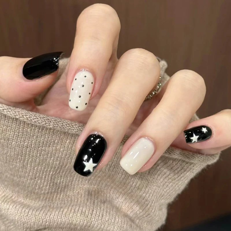Artistic Press-On Nail Design with Stars and Polka Dots Stornfield