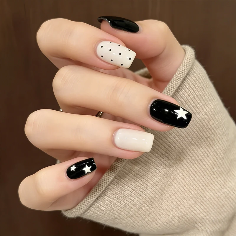 Artistic Press-On Nail Design with Stars and Polka Dots Stornfield