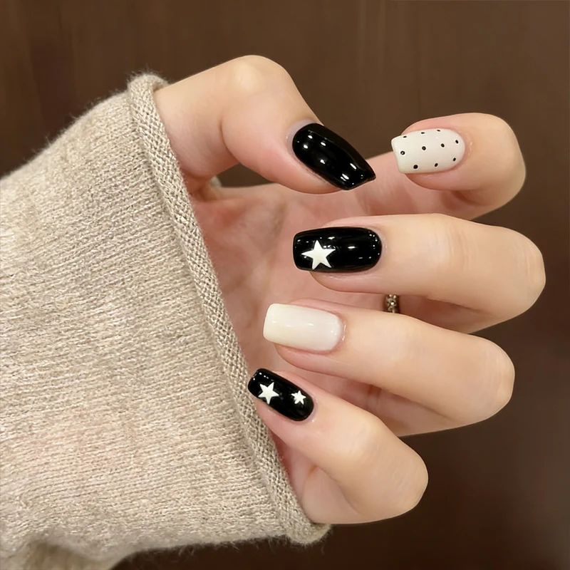 Artistic Press-On Nail Design with Stars and Polka Dots Stornfield