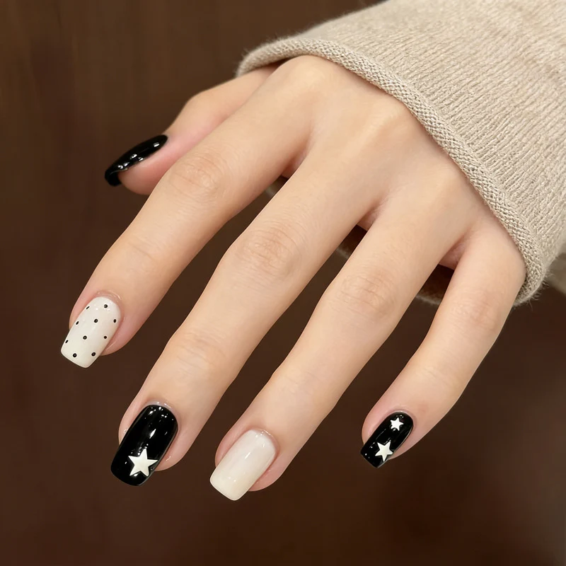 Artistic Press-On Nail Design with Stars and Polka Dots Stornfield