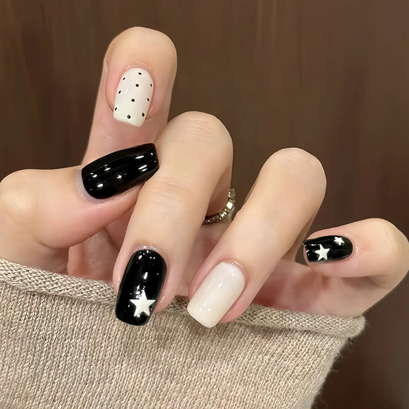 Artistic Press-On Nail Design with Stars and Polka Dots Stornfield