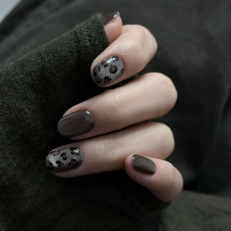 Artistic Press-On Nail Design with Glossy and Textured Patterns Stornfield