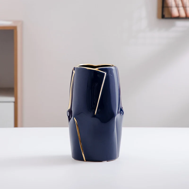 Decorative ceramic vase with golden accents Stornfield