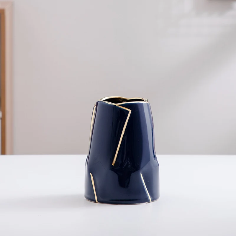 Decorative ceramic vase with golden accents Stornfield