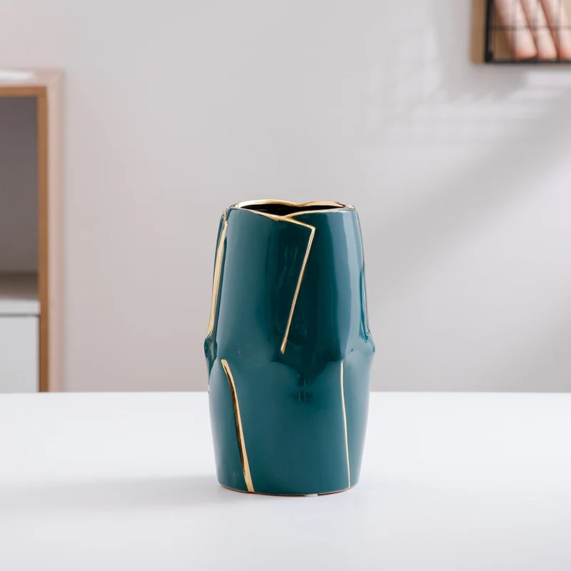 Decorative ceramic vase with golden accents Stornfield
