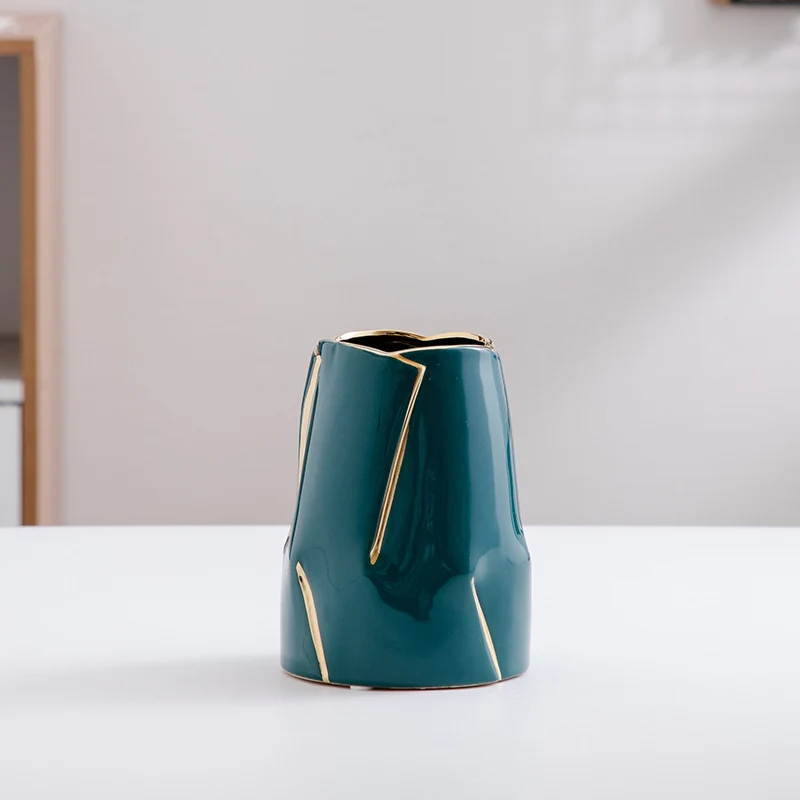 Decorative ceramic vase with golden accents Stornfield