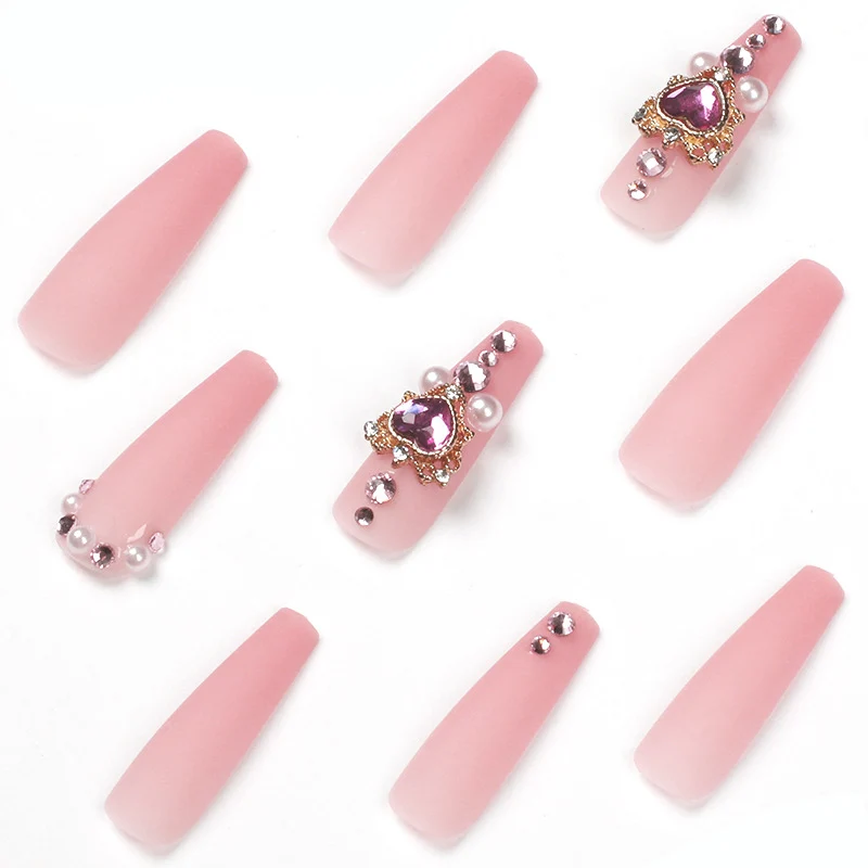 Creative artificial nails with heart-shaped decorative accents Stornfield