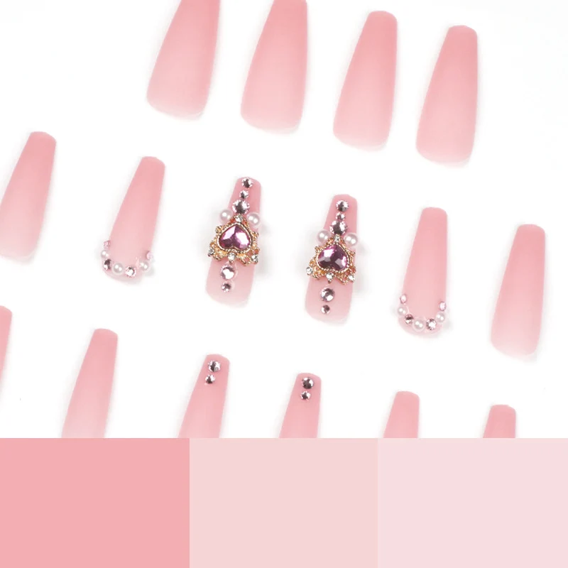 Creative artificial nails with heart-shaped decorative accents Stornfield