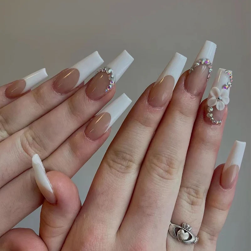 Creative artificial nails with elegant rhinestone and floral accents Stornfield