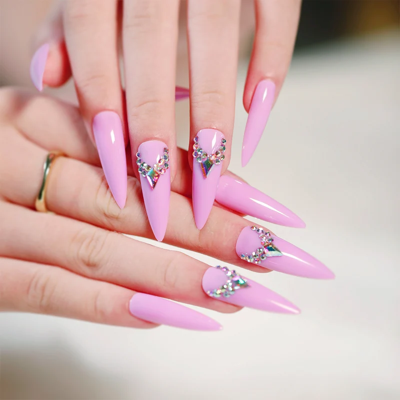 Glamorous stiletto nails with rhinestone decoration Stornfield