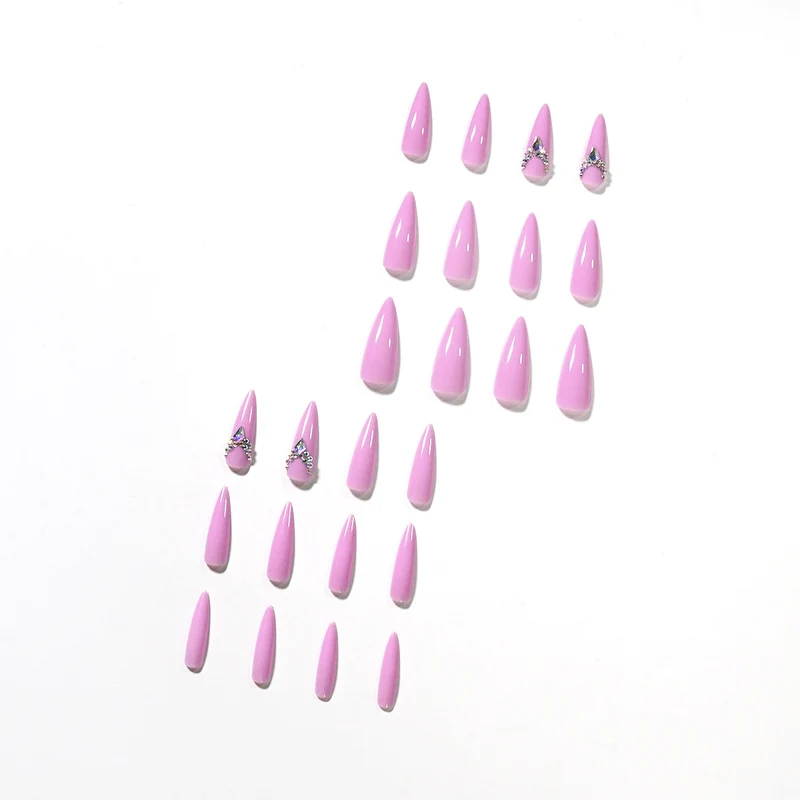 Glamorous stiletto nails with rhinestone decoration Stornfield